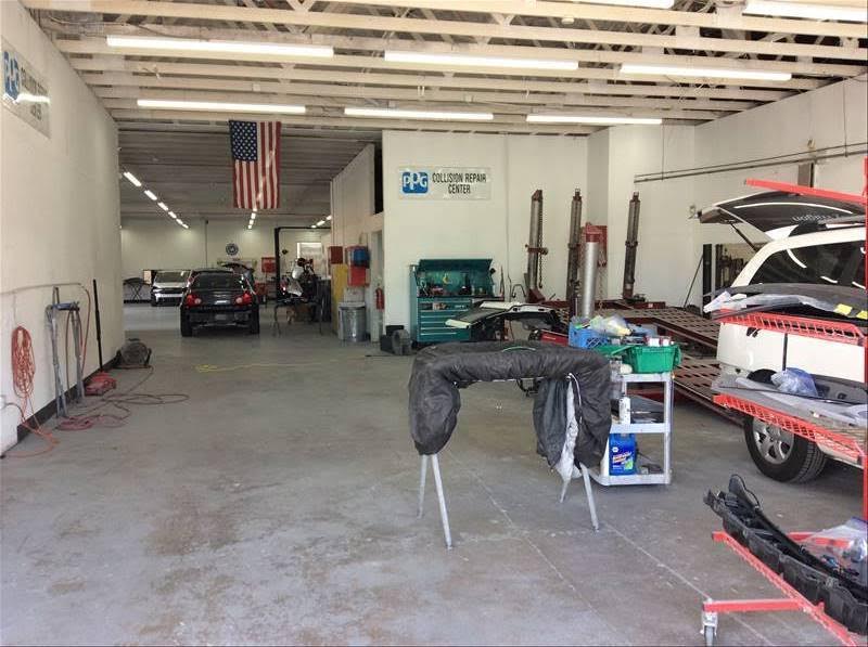 Work area with a vehicle being disassembled and parts racks
